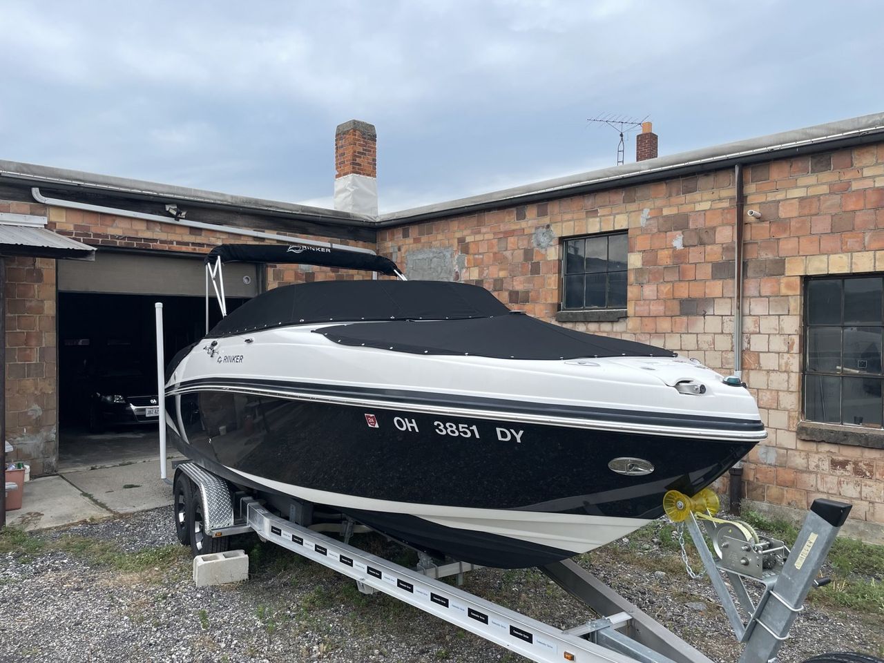 View Dark fitted cover on a trailered boat